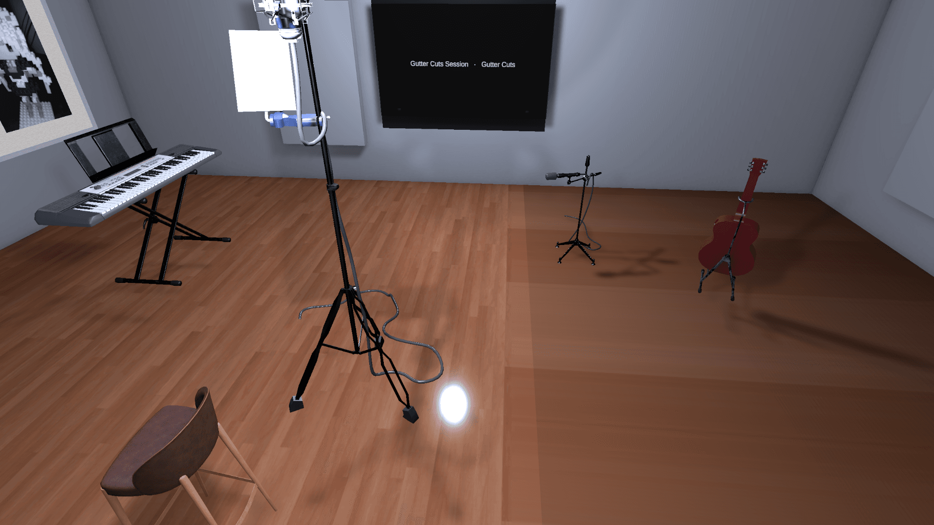 Studio B's vocal booth with a mic stand, keyboard, and guitar, wall display reading 'Gutter Cuts Session'